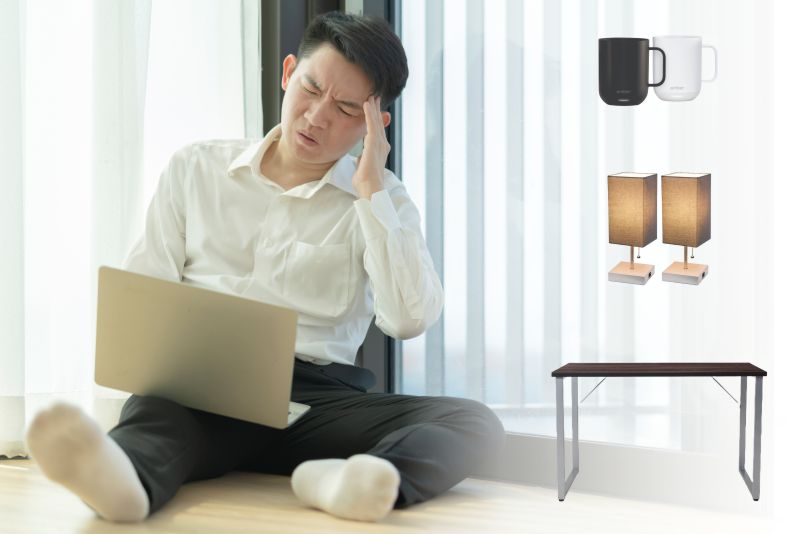 Man working on the floor with no desk is not happy