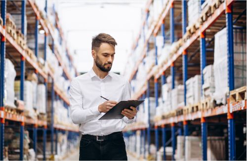 Worker checking stock on international supply chain professionals day