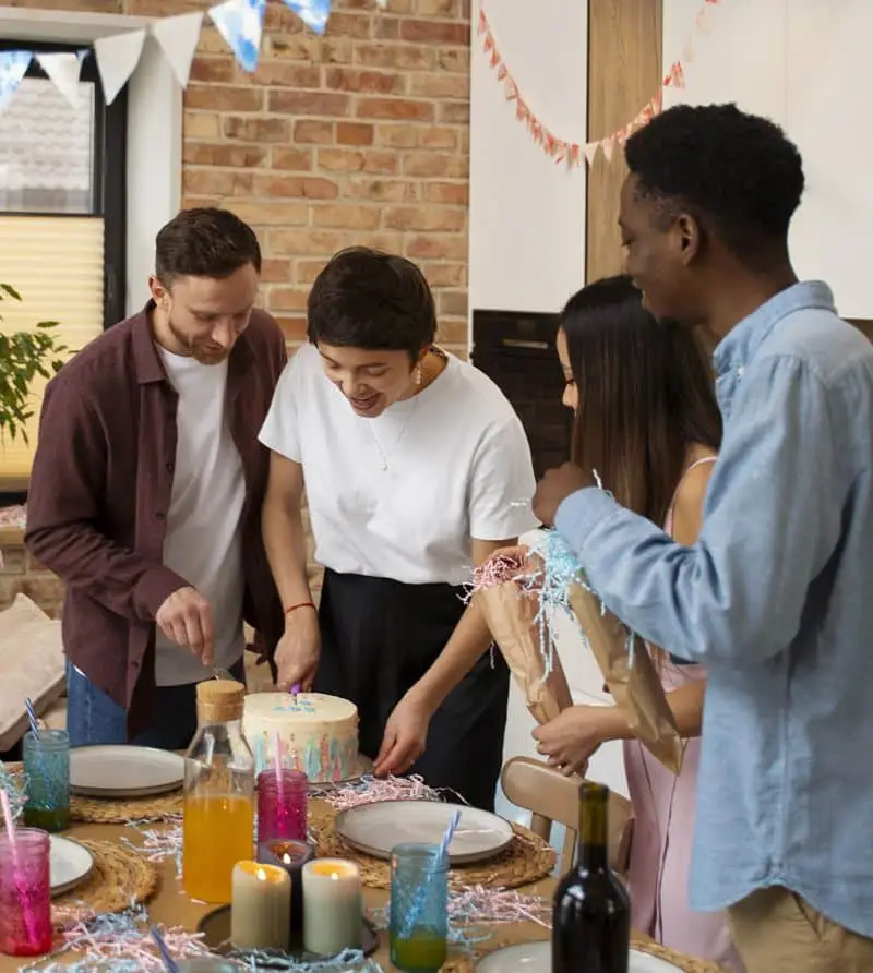 employees enjoying cake at a monthly employee birthday party.