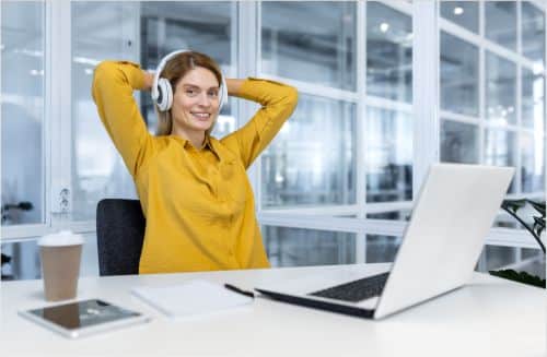 Woman at desk after completing some very complex coding