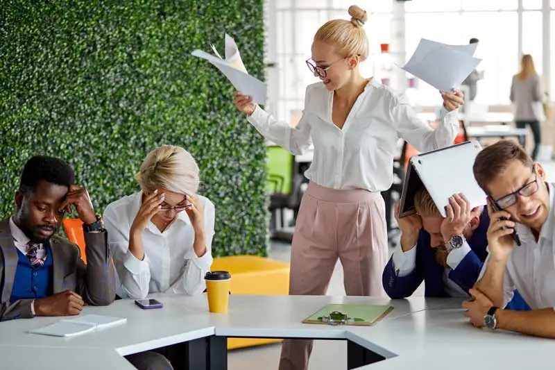 A group of exhausted looking employees who need a break