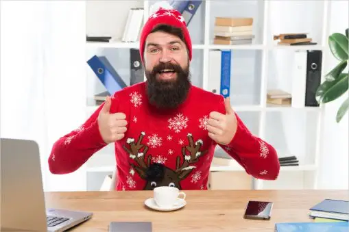 A happy man just received a digital Christmas card and gift