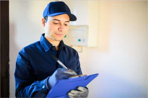 Custodial worker checking a clipboard