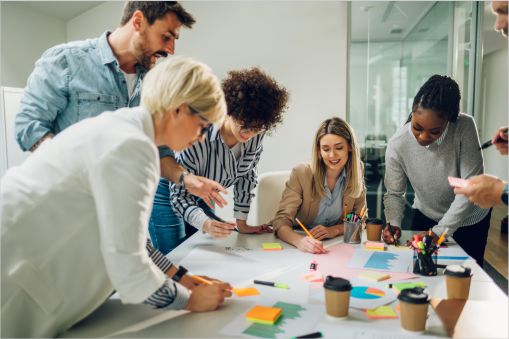 Team of workers over a table working on a project