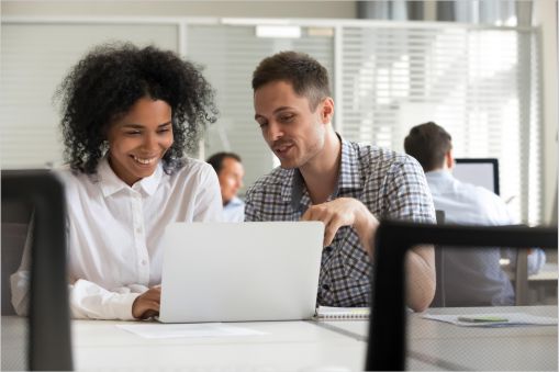 One employee mentoring another on world kindness day