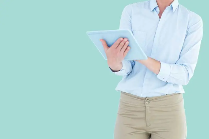 woman looking at reports on tablet