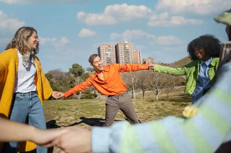 employees playing a circle game at picnic