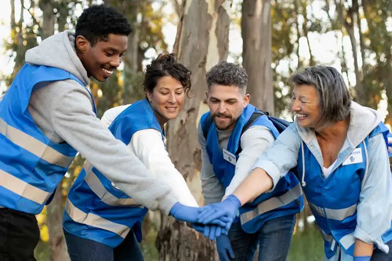 employees participating in an outdoor volunteer project