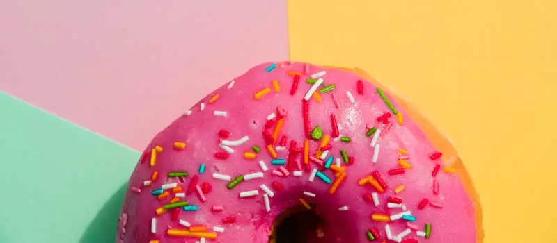 donut day donut with sprinkles on yellow pink mint-green backdrop