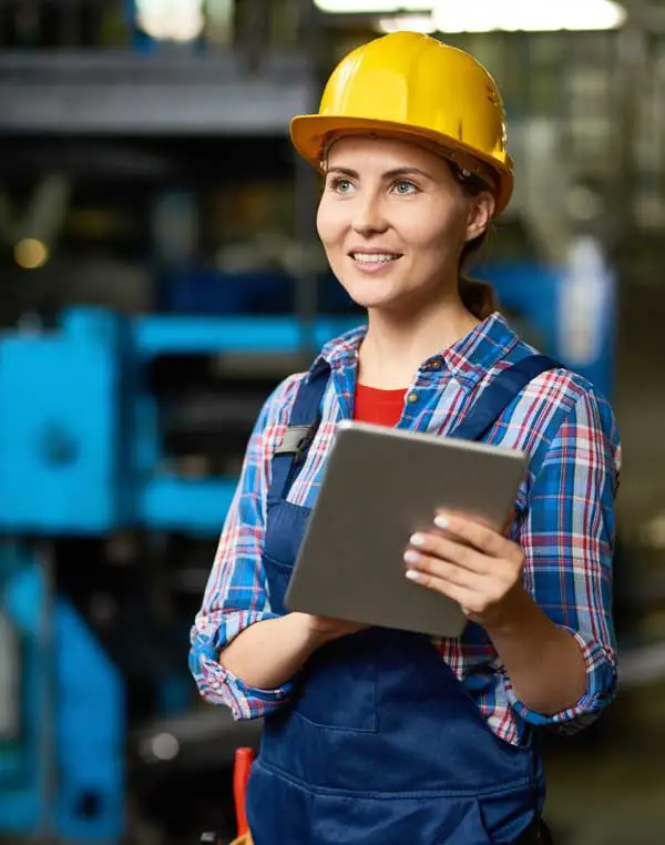 woman engineer working factory floor with clipboard