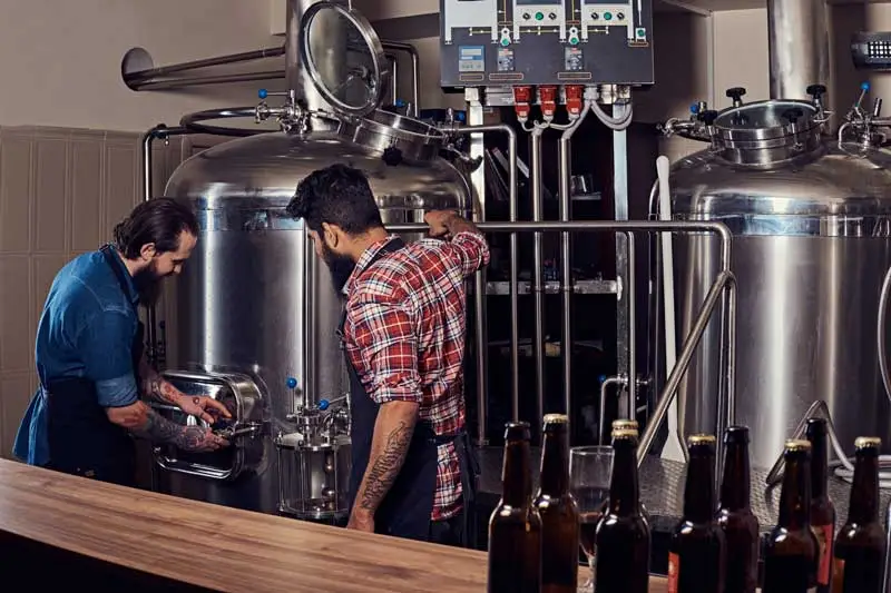 two men working in a craft brewery