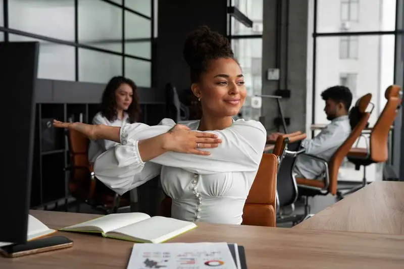 woman stretching at work