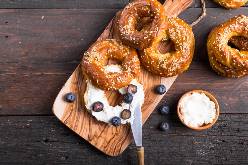 bagels with creme cheese and blueberries for national bagel day