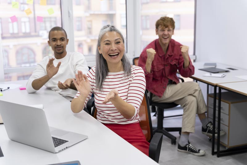 Happy employees clapping after another message of gratitude and appreciation