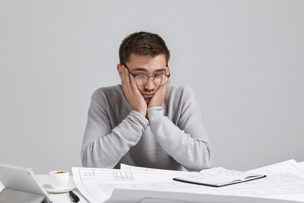 Frustrated program manager reviewing the amount of unclaimed gift cards in his latest program