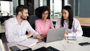 Three researchers discussing research payments