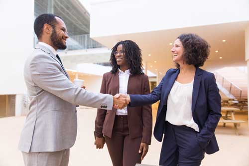 congratulations handshake between business people