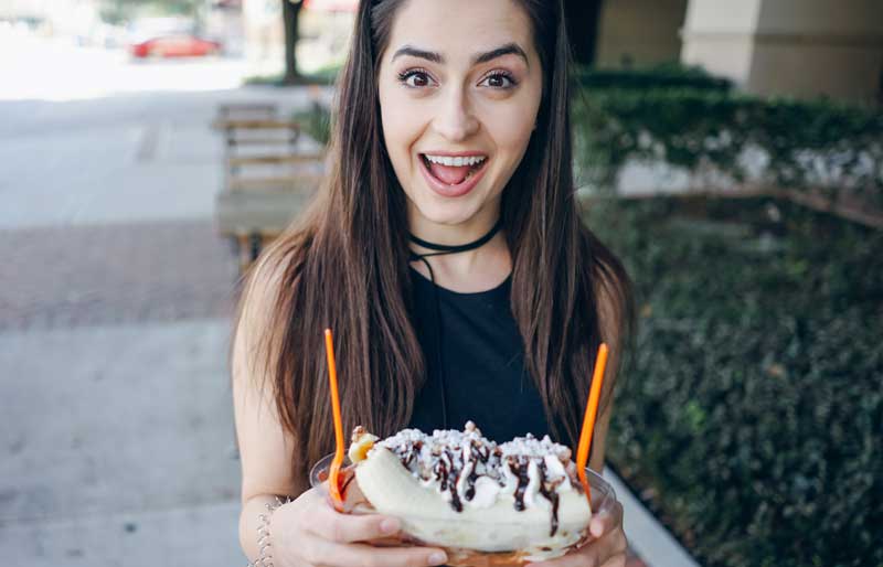 woman smiling at banana split