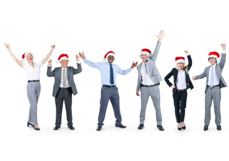 group of business people cheering holiday swag in Christmas hats