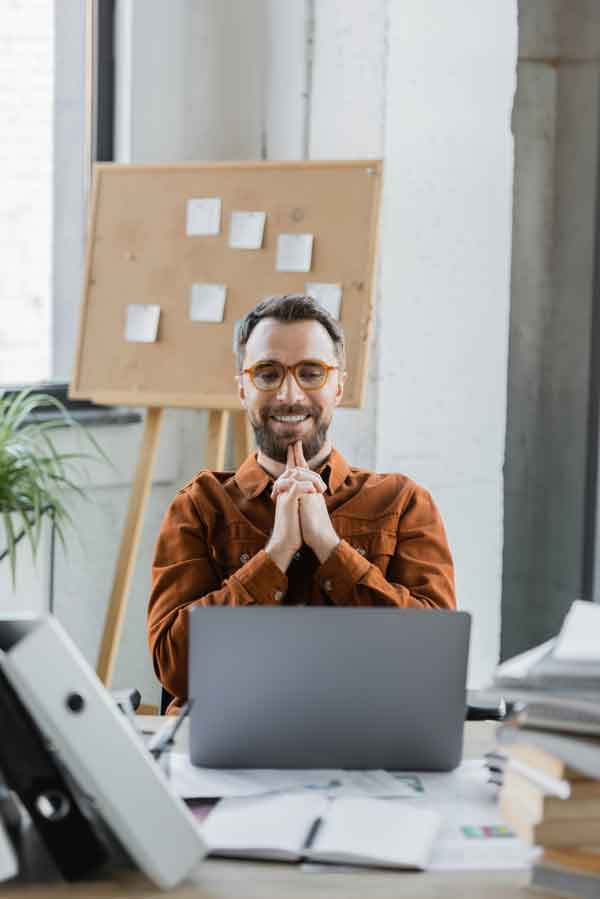 gratified bearded businessman looking at laptop Gratitude, Casual Incentives and Balance