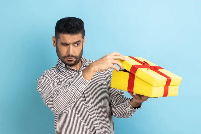 Person disappointed by an unsuitable employee gift
